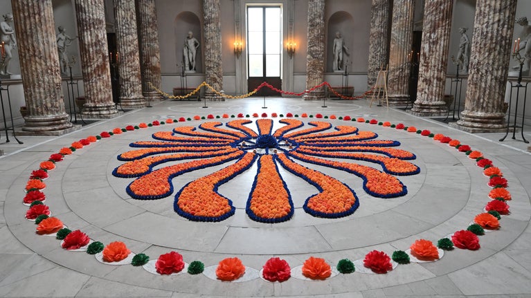 Orange sholapith (indian cork) displayed in rangoli artwork